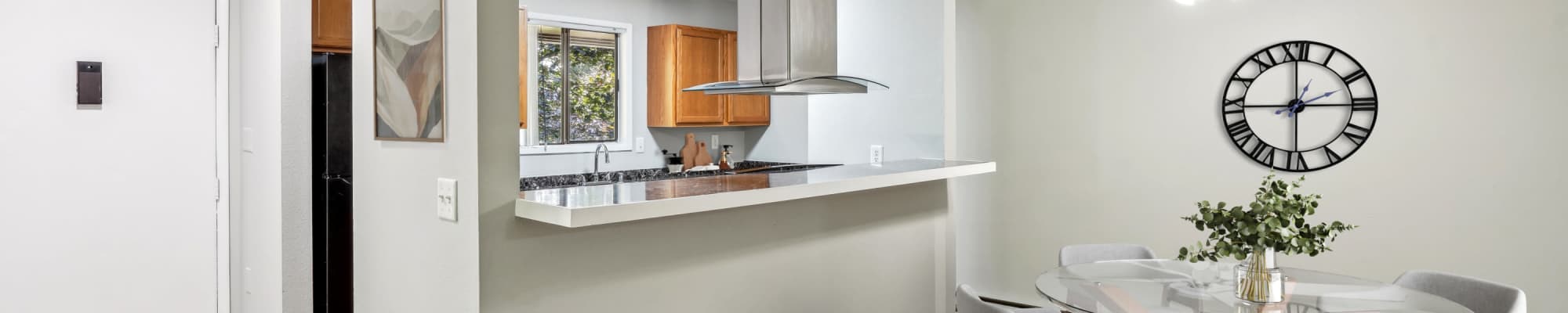 Dining area and kitchen at Oakbrook Apartment Homes in Vancouver, Washington