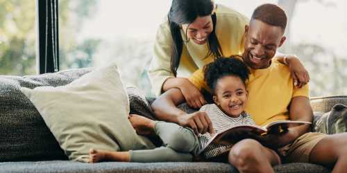 Family in the living room at Pinecrest Apartments in Fallbrook, California