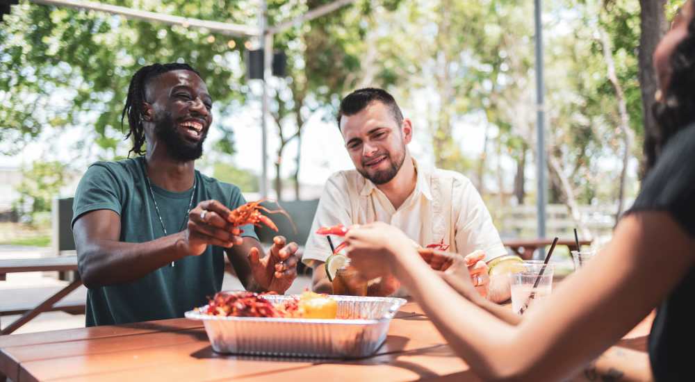 Residents enjoying a meal near Howell Uptown in Dallas, Texas