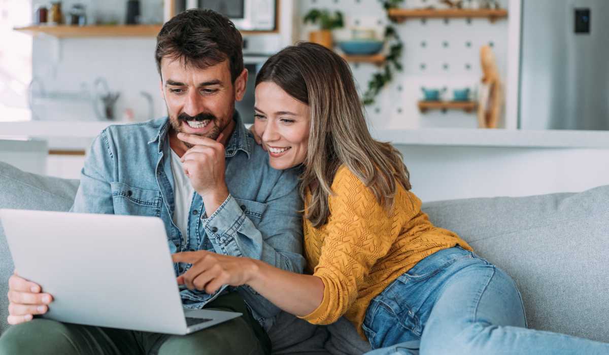 Resident couple using laptop at Taft Haus in Wichita Falls, Texas