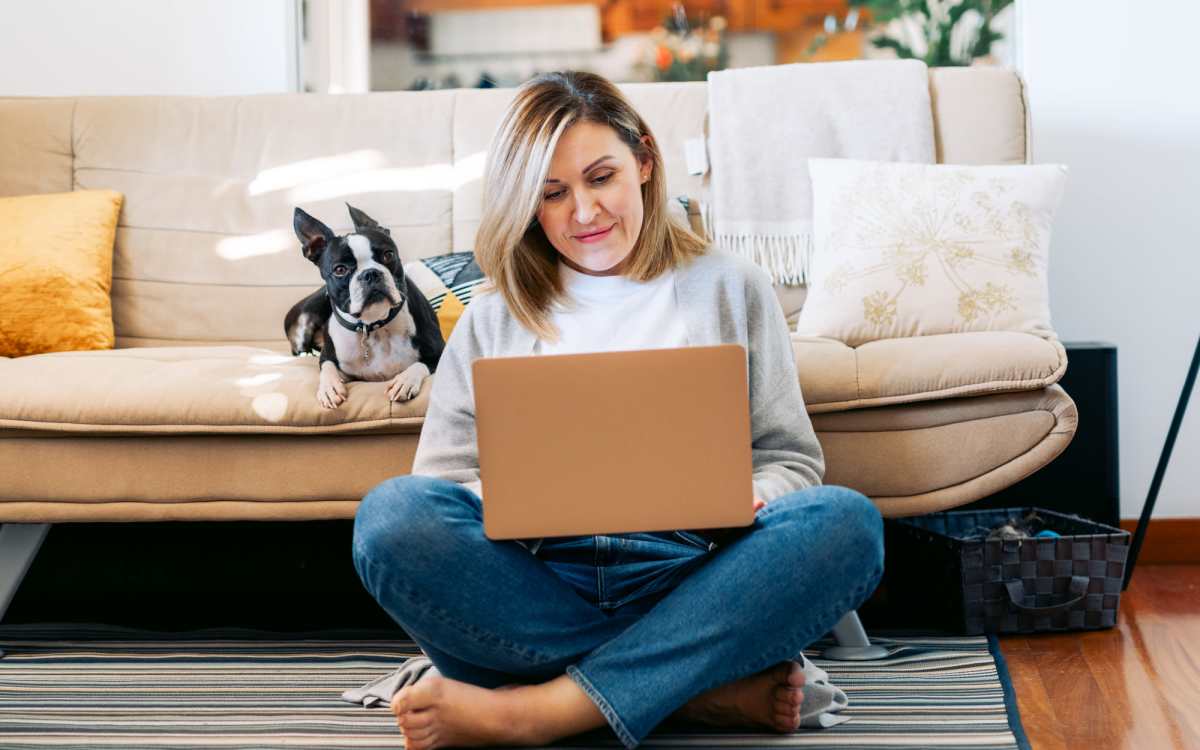 Woman using her laptop at The Falgrove Apartments in Omaha, Nebraska