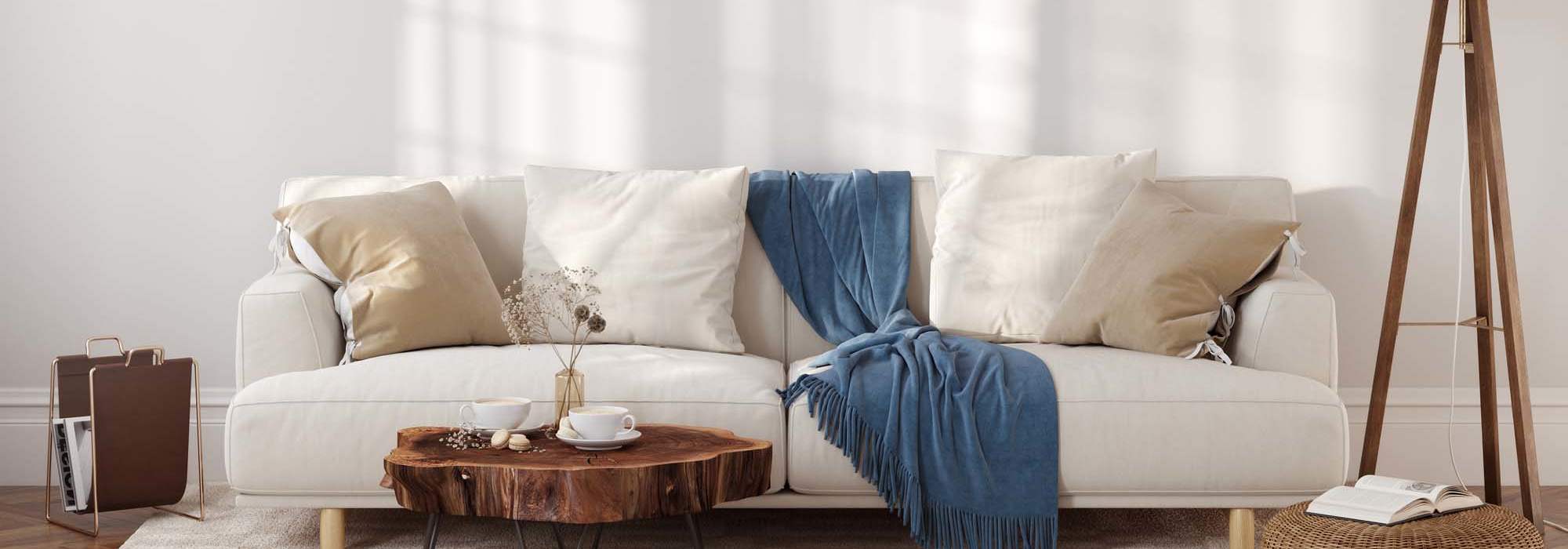 Schedule a Tour | A well-lit living room with cozy furnishings at Brentwood Apartments in Portland, Oregon