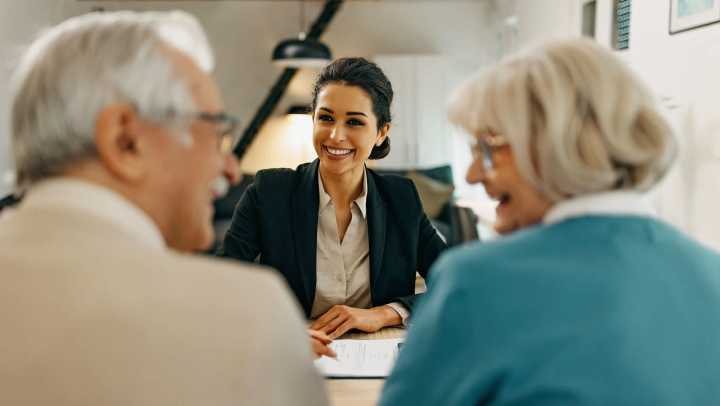 Old man and woman consulting with a consultant