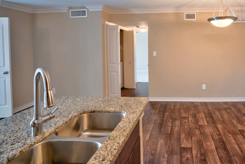 Granite countertops in a model home's kitchen at Southwind at Silverlake Apartments in Pearland, Texas