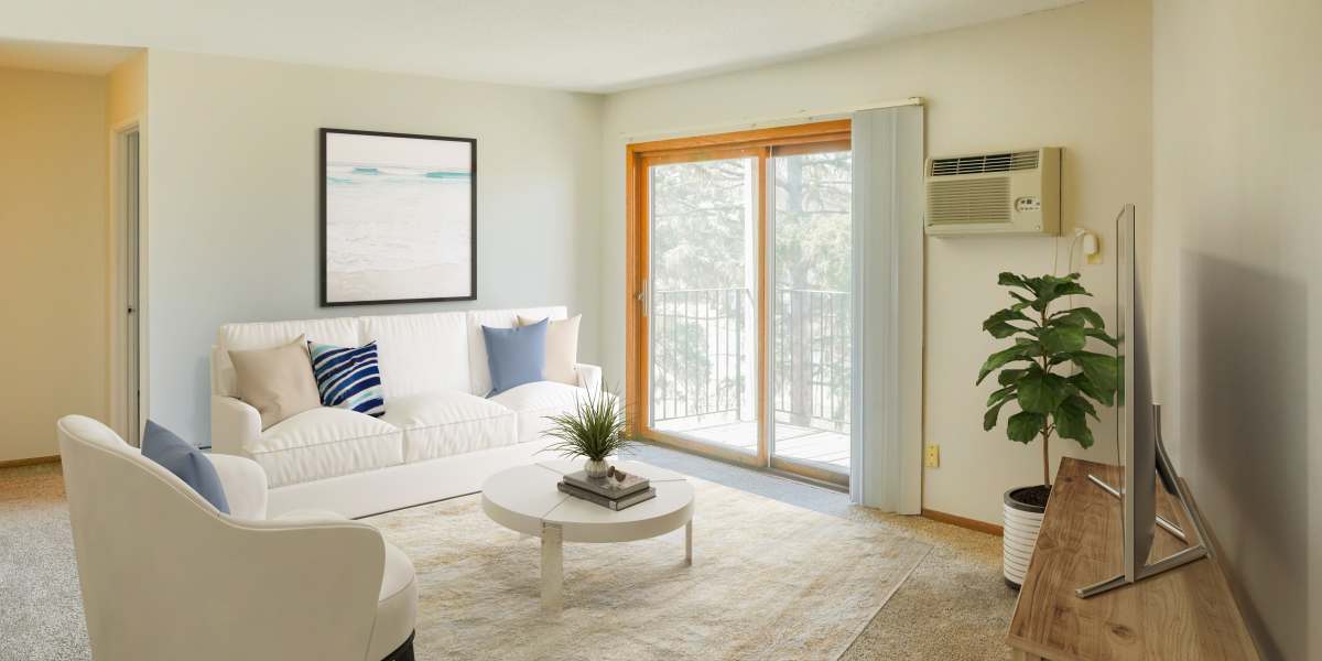 Spacious living room with sliding glass doors for patio access at Fountain Terrace in New Brighton, Minnesota