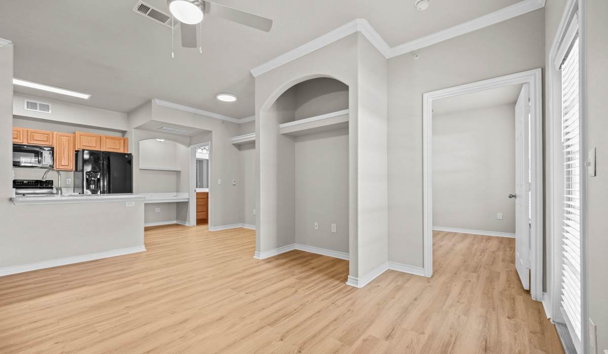 Living room with wood flooring at Hidden Creek in Allen, Texas
