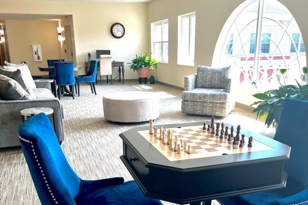Resident lounge with chess table and computer station at Hanover Place in Tinley Park, Illinois.