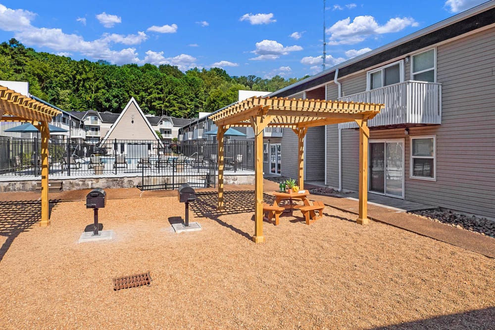 Two grills and an outdoor seating area at The Reserve at Red Bank Apartment Homes in Chattanooga, Tennessee