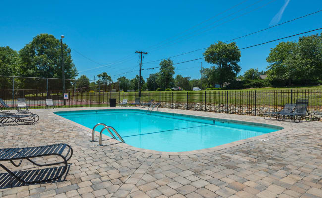 Swimming pool with a paved sundeck at Lakewood Apartment Homes in Salisbury, North Carolina