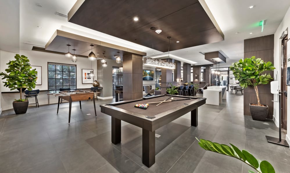Clubhouse area with a billiards table for residents to use at 6600 Main in Miami Lakes, Florida
