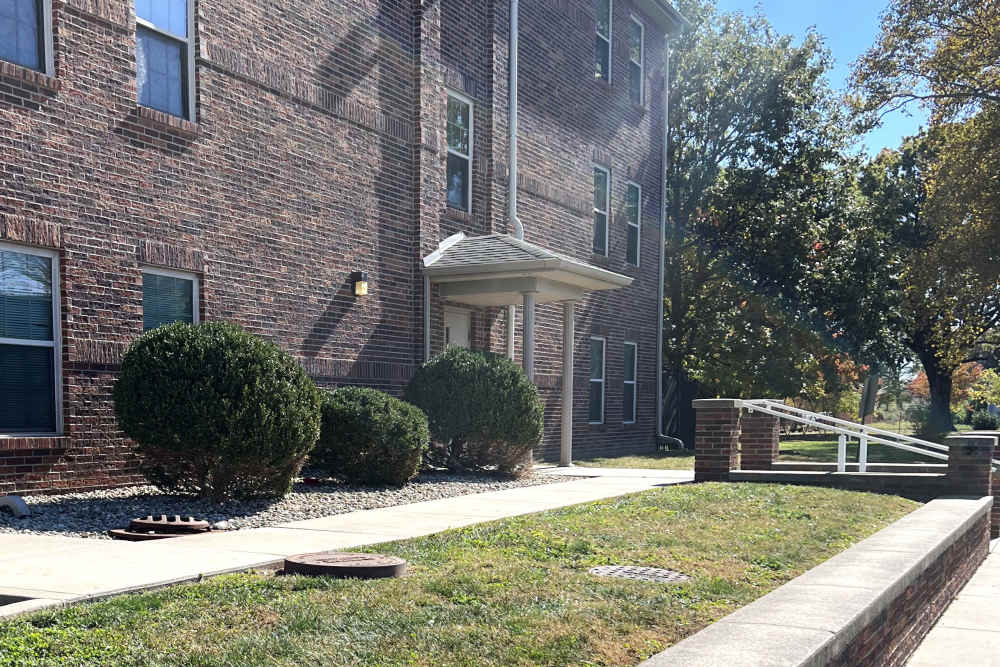 A sunny exterior of the community at Wexford on the Park Apartments in Indianapolis, Indiana