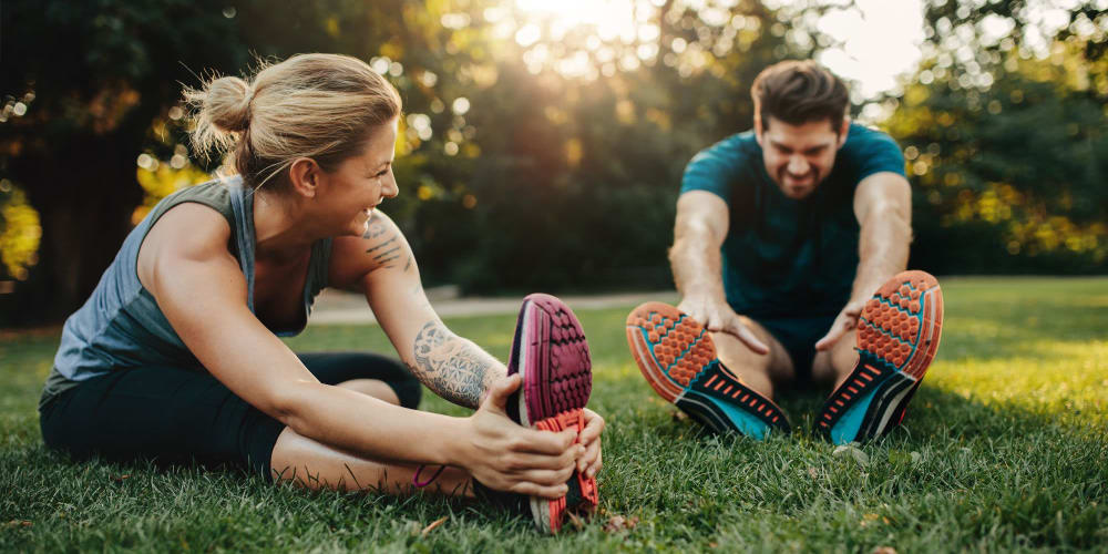 Residents stretching in a park near Veridian in Cincinnati, Ohio