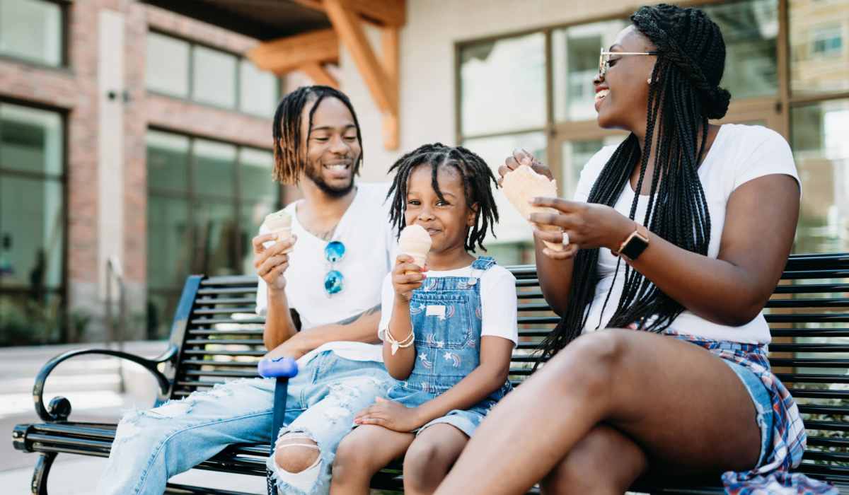 Family enjoying ice cream outdoors at Barrington Place at Winter Haven in Winter Haven, Florida
