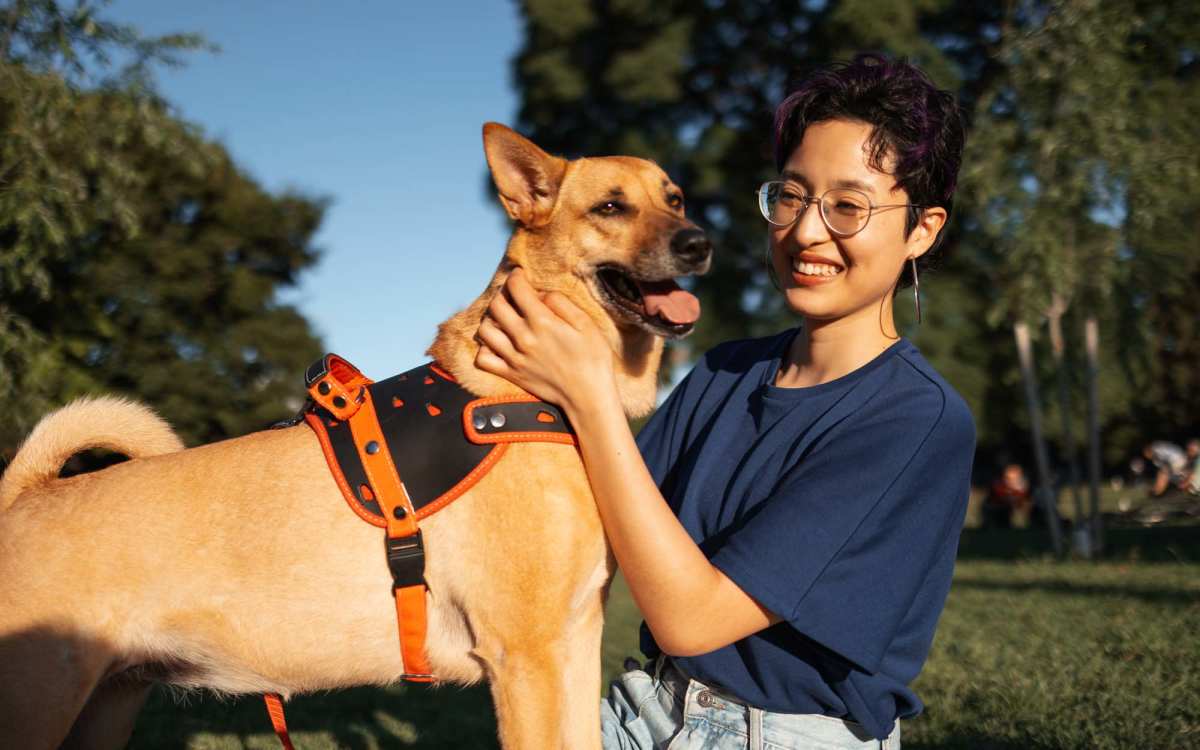 Resident walking their dog through a park near Ocean View Living in Norfolk, Virginia