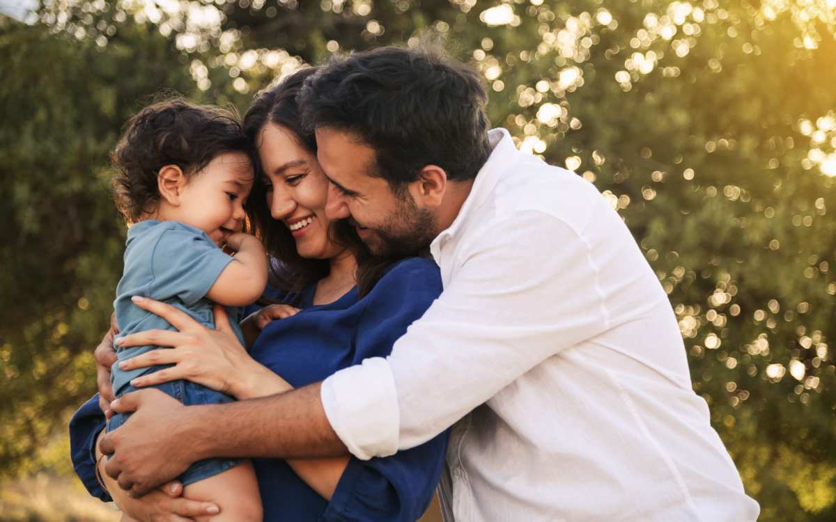 Happy family in a park near Ochlockonee Pointe Apartments in Midway, Florida