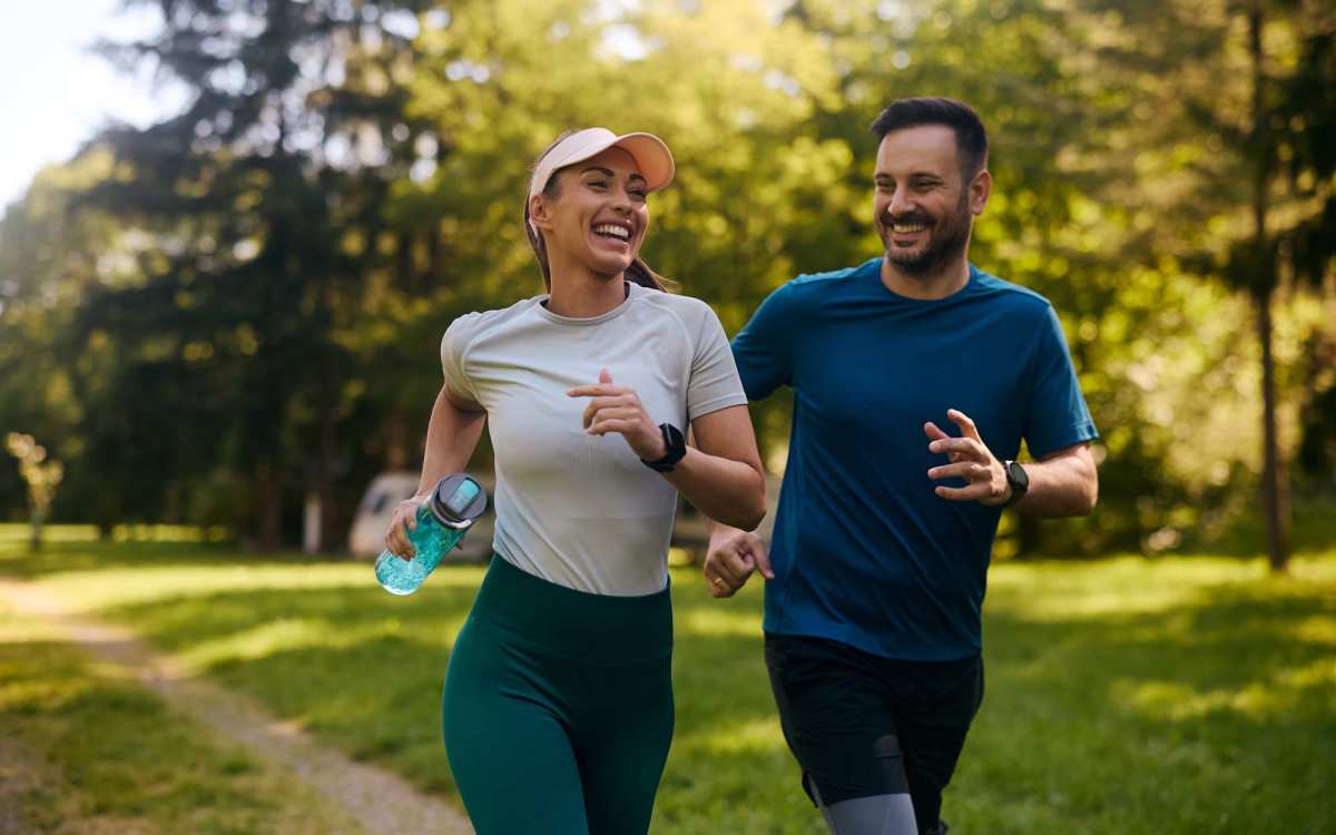 Resident couple jogging in a park near Millcroft Apartments & Townhomes in Milford, Ohio