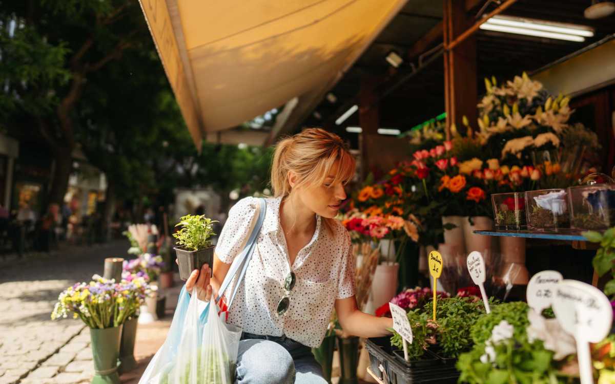 Resident buying fresh flowers near Sunset Bay Apartments in Cutler Bay, Florida