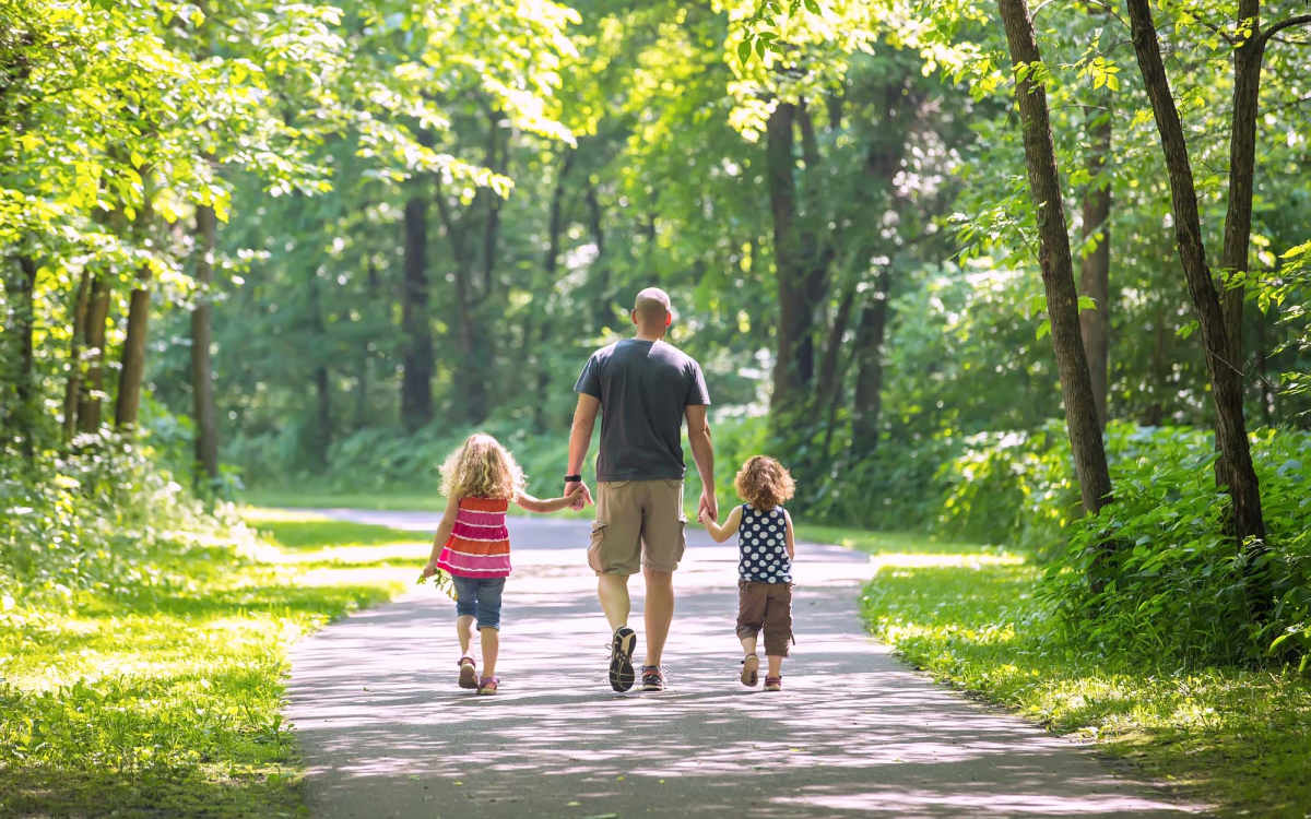 Resident with his kids in a park near Yale Street Commons in Bridgeport, Connecticut