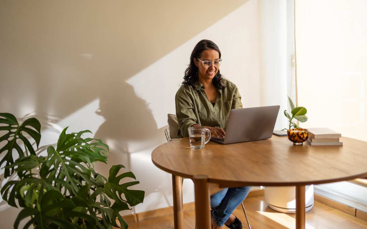 Resident in a cafe using her laptop at Yale Street Commons in Bridgeport, Connecticut