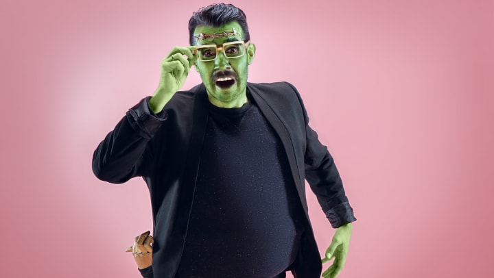 Man dressed as Frankenstein’s monster, pink background