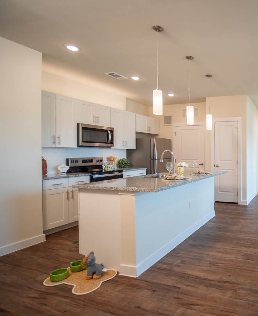kitchen with island at Cypress Creek at Stoney Ridge in Del Valle, Texas