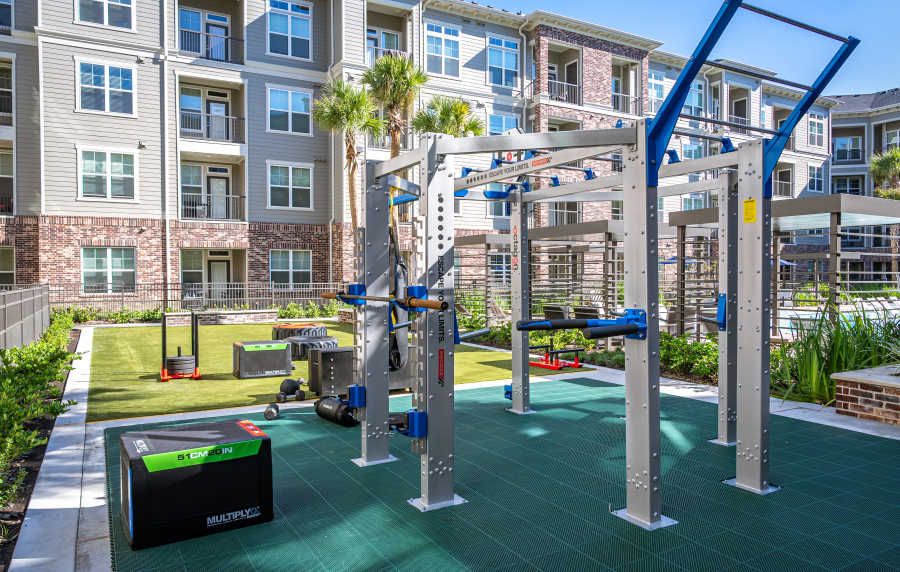 Outdoor fitness area within an apartment community at Charleston at Fannin Station in Houston, Texas