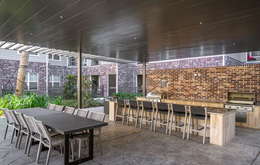 Covered outdoor grilling and dining area at Charleston at Fannin Station in Houston, Texas