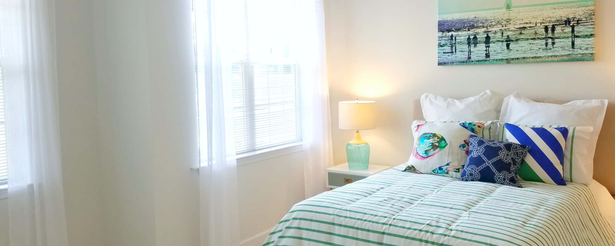Bedroom with large windows at Leander Lakes in Dover, Delaware