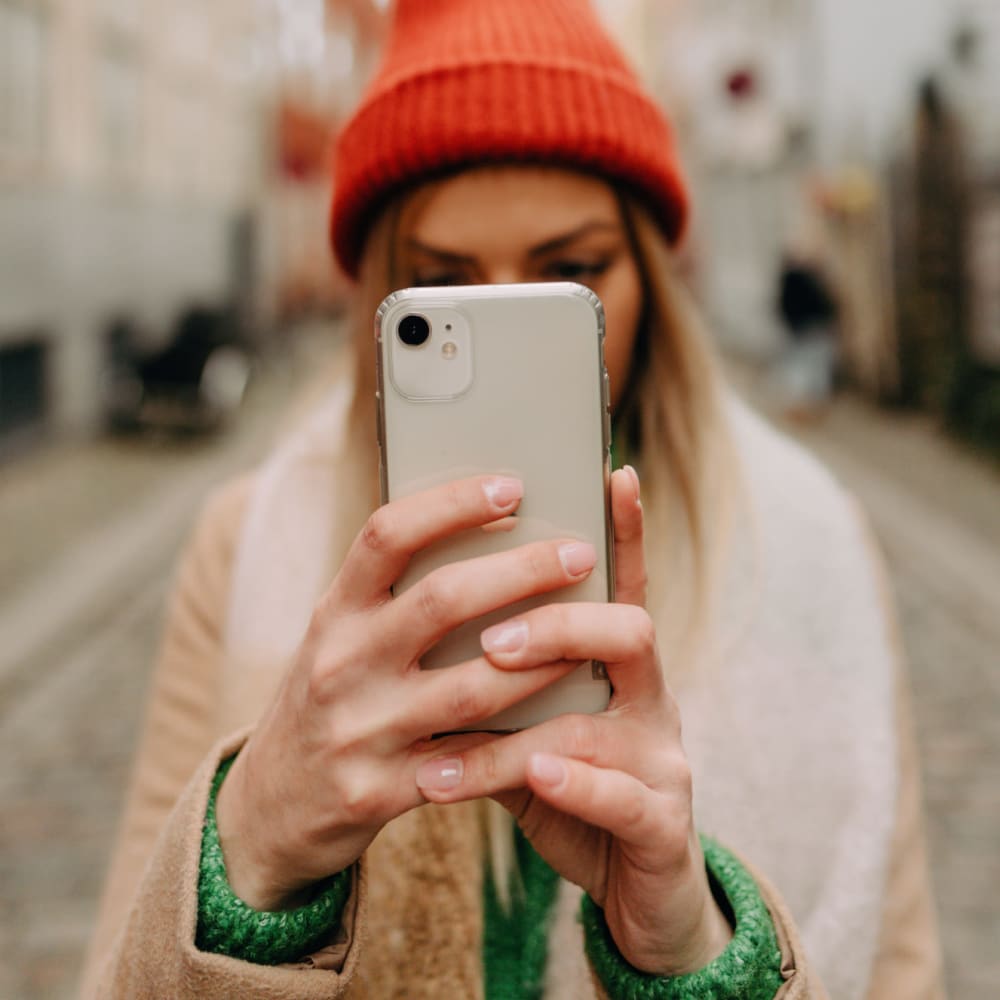 A photo of a girl taking a photo on her phone at The Ivy in Tampa, Florida