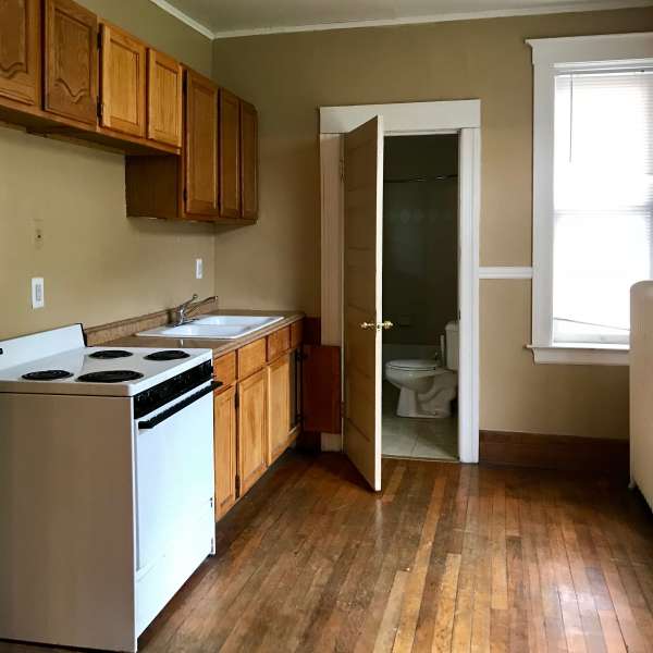 Kitchen with wood furnishings at Detroit Living in Detroit, Michigan