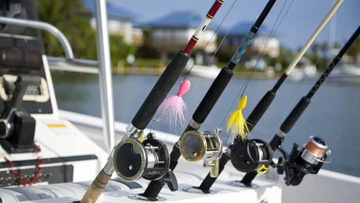 Four fishing reels in a boat