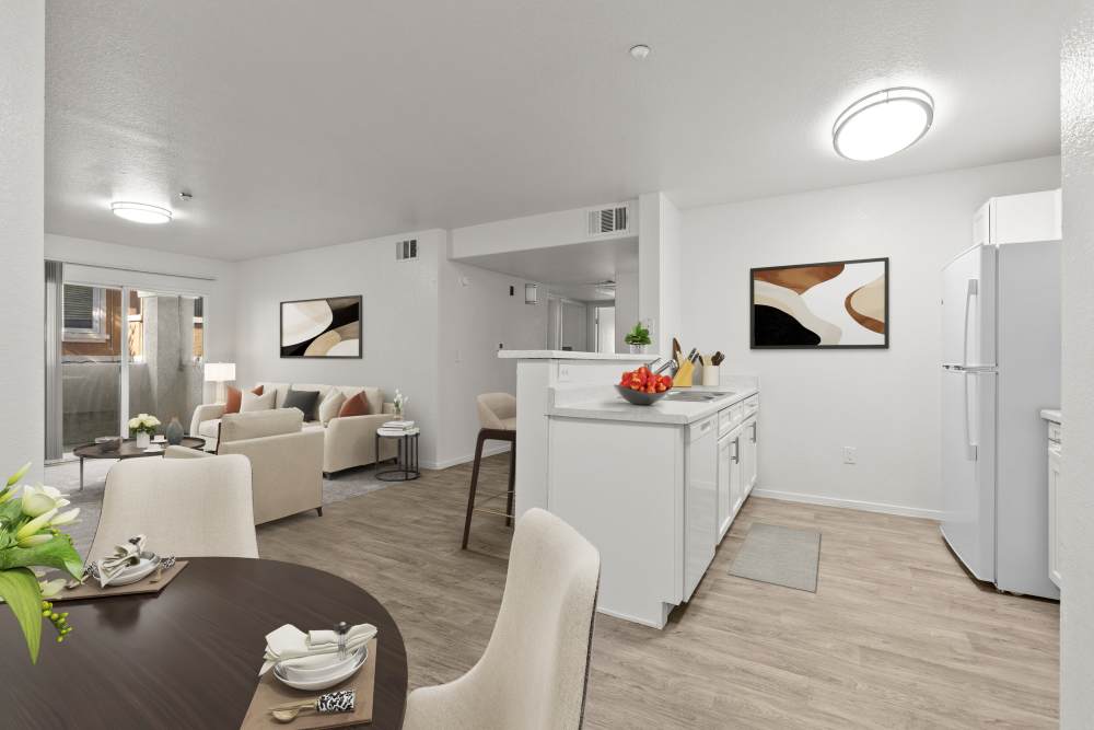 Modern open-plan apartment with white walls and wood flooring  at Zephyr Pointe in Reno, Nevada  