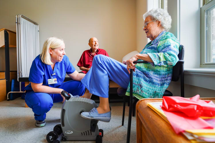 A caretaker assisting a resident at Harmony Senior Services in Charleston, South Carolina