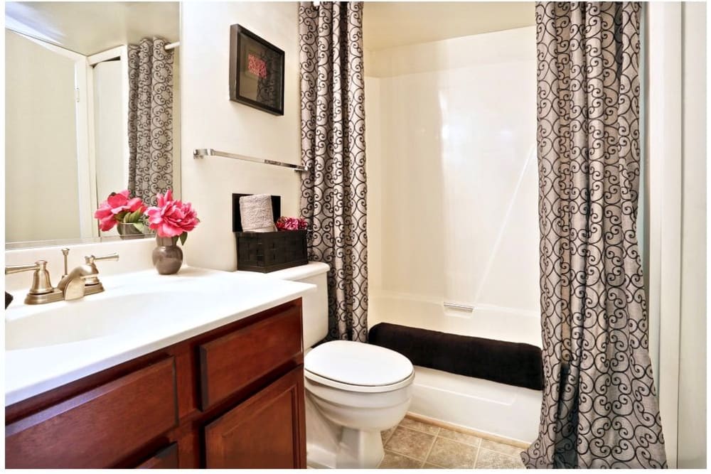 modern bathroom with grey shower curtain in virginia beach virginia
