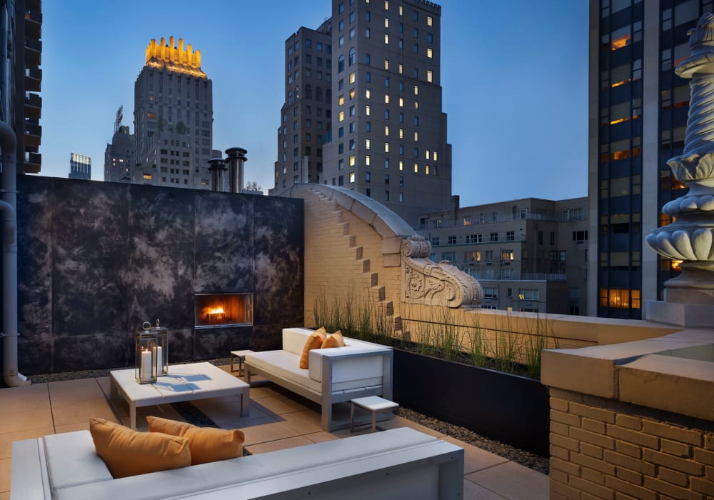 Luxurious rooftop lounge with an amazing skyline view at twilight at a high-rise extended stay property in New York by Electra America in Lake Park, Florida