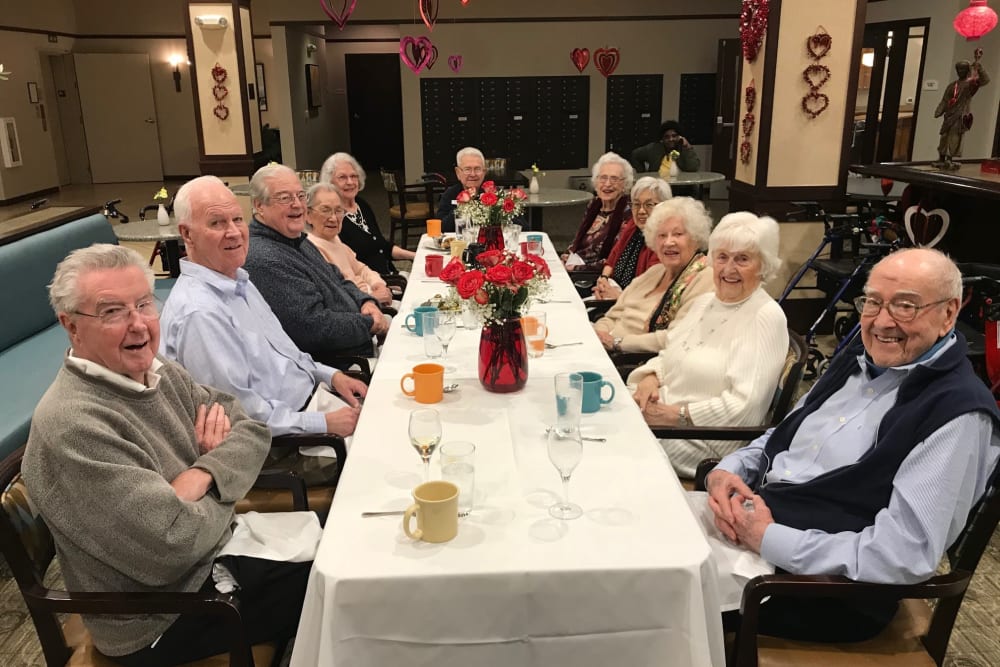 Group of residents enjoying dinner at Merrill Gardens at Kirkland in Kirkland, Washington. 