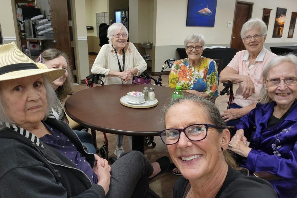 A staff member and two residents enjoying a party at Truewood by Merrill, Ocean Springs in Ocean Springs, Mississippi. 