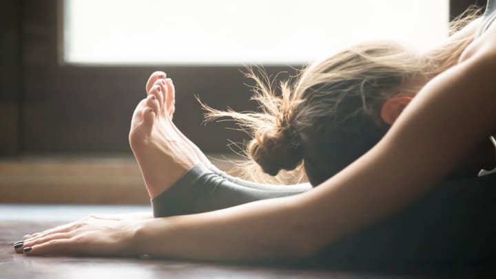 Resident enjoying a pilates class near Olympus Steelyard in Chandler, Arizona. 