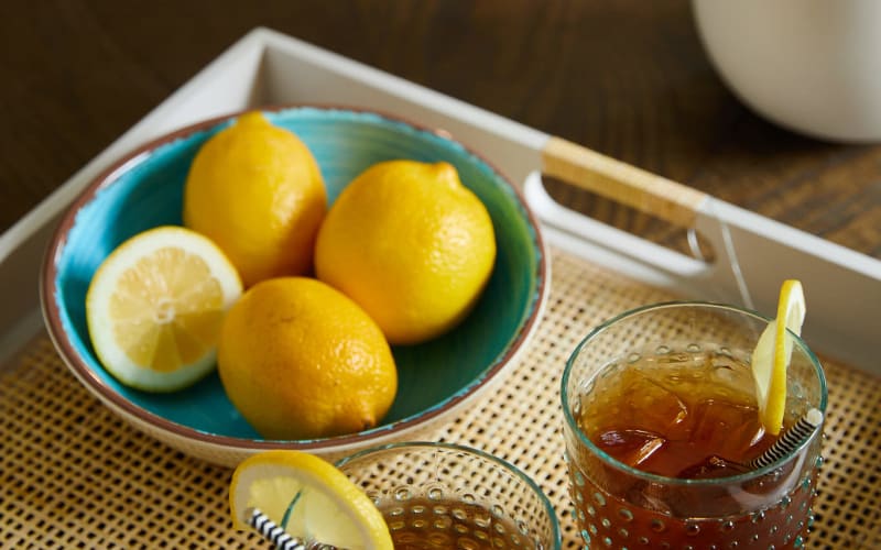 Glasses of iced tea and a bowl of lemons on a tray at Amira Choice Roseville at Lexington in Roseville, Minnesota