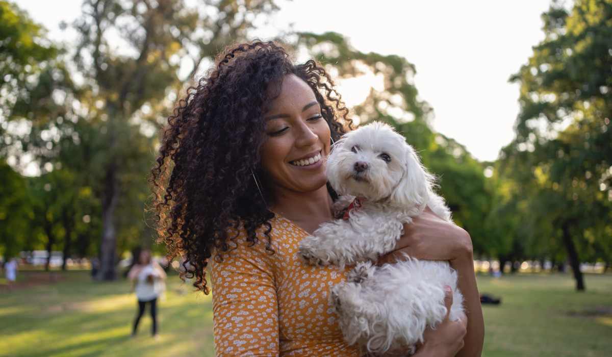 Resident playing with her dog at Sagewood Estates in Portland, Oregon