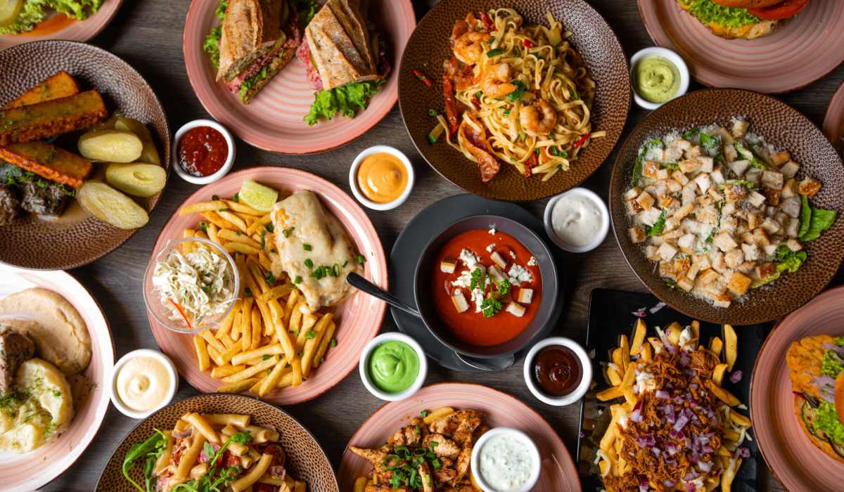  Table filled with a variety of restaurant dishes near Atz Place in Kendallville, Indiana