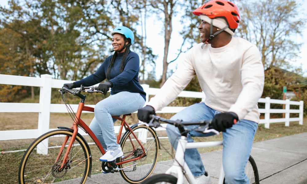 Couple biking on a path near A.L. Miller Village in Macon, Georgia