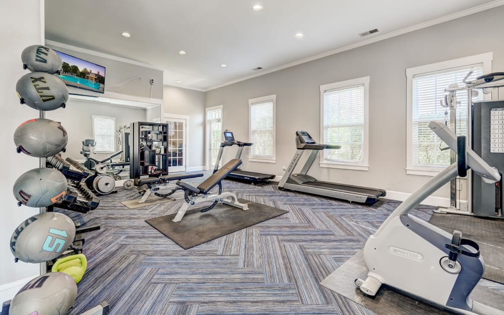 Well-equipped fitness center with cardio equipment at The Woods at Polaris Parkway Apartments & Townhomes in Westerville, Ohio