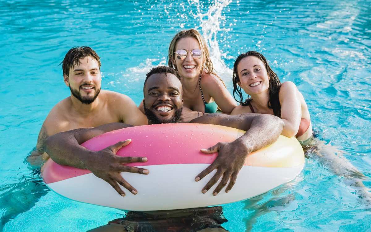 Group of residents having fun in the community swimming pool at Kirman Garden in Reno, Nevada