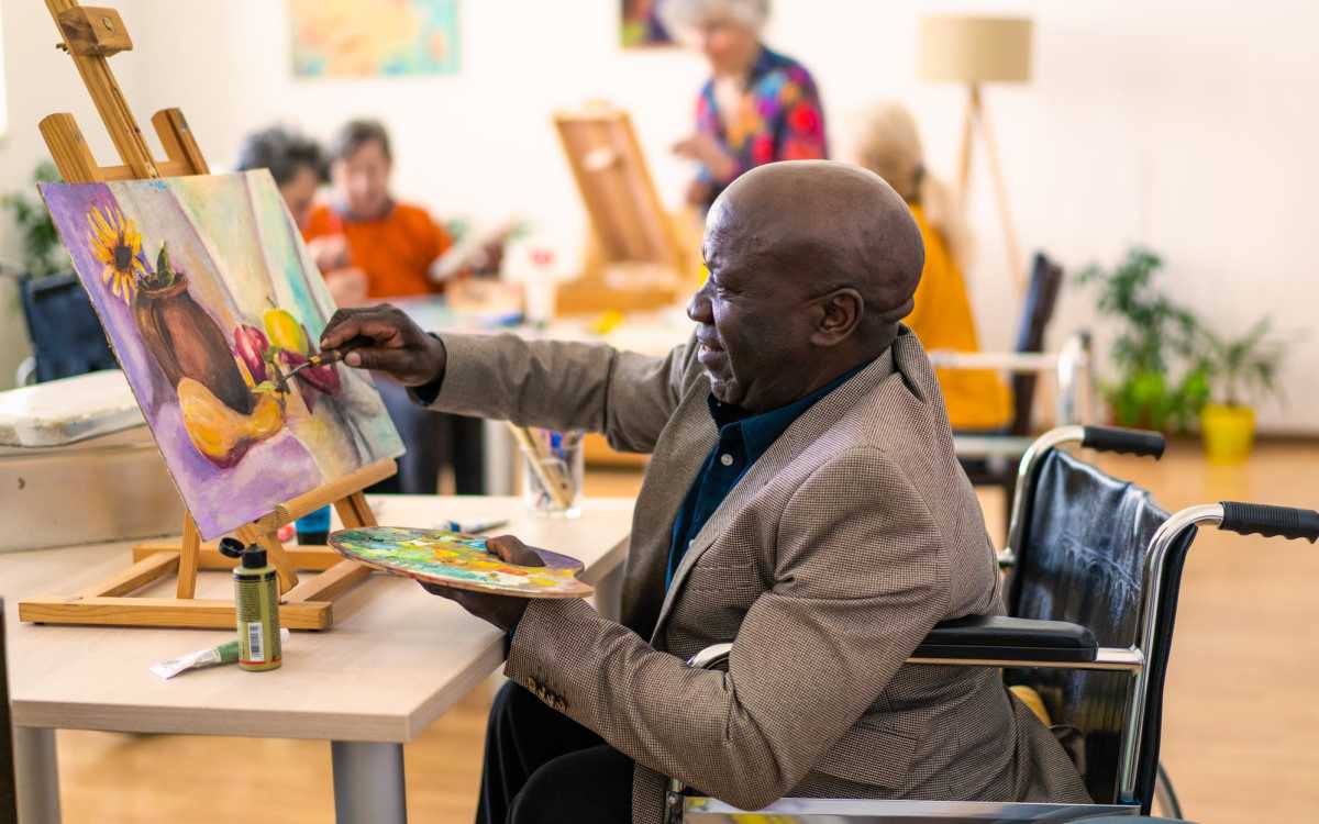 Resident doing art activity at The Cascalote in Glendale, Arizona