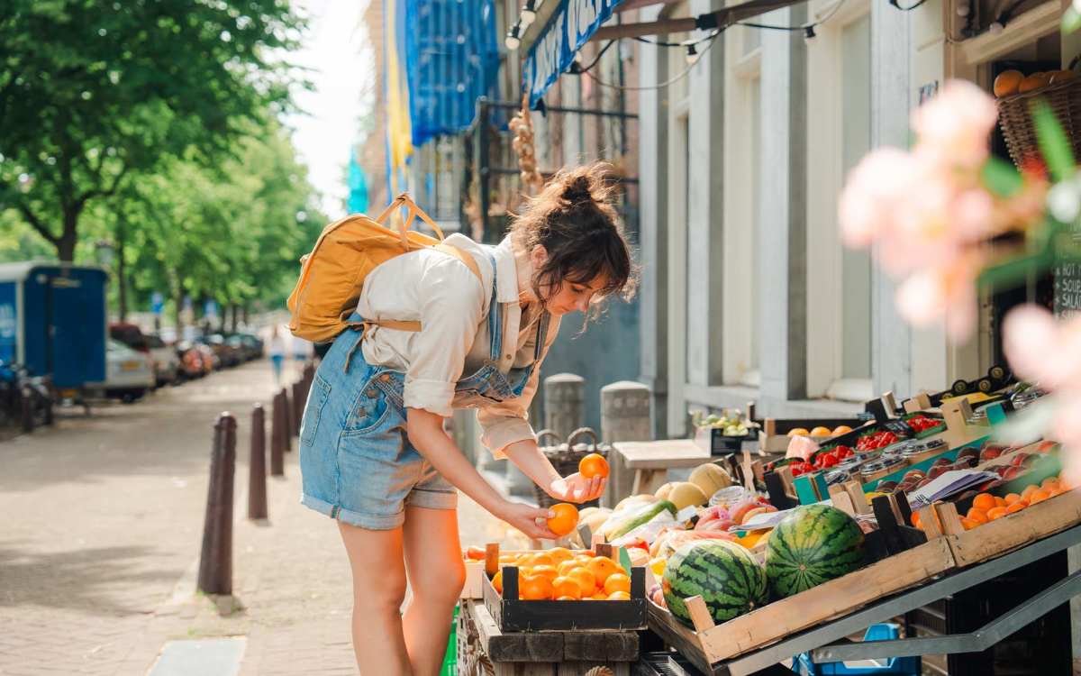 Resident picking some fresh fruits near High Street Lofts in Petersburg, Virginia