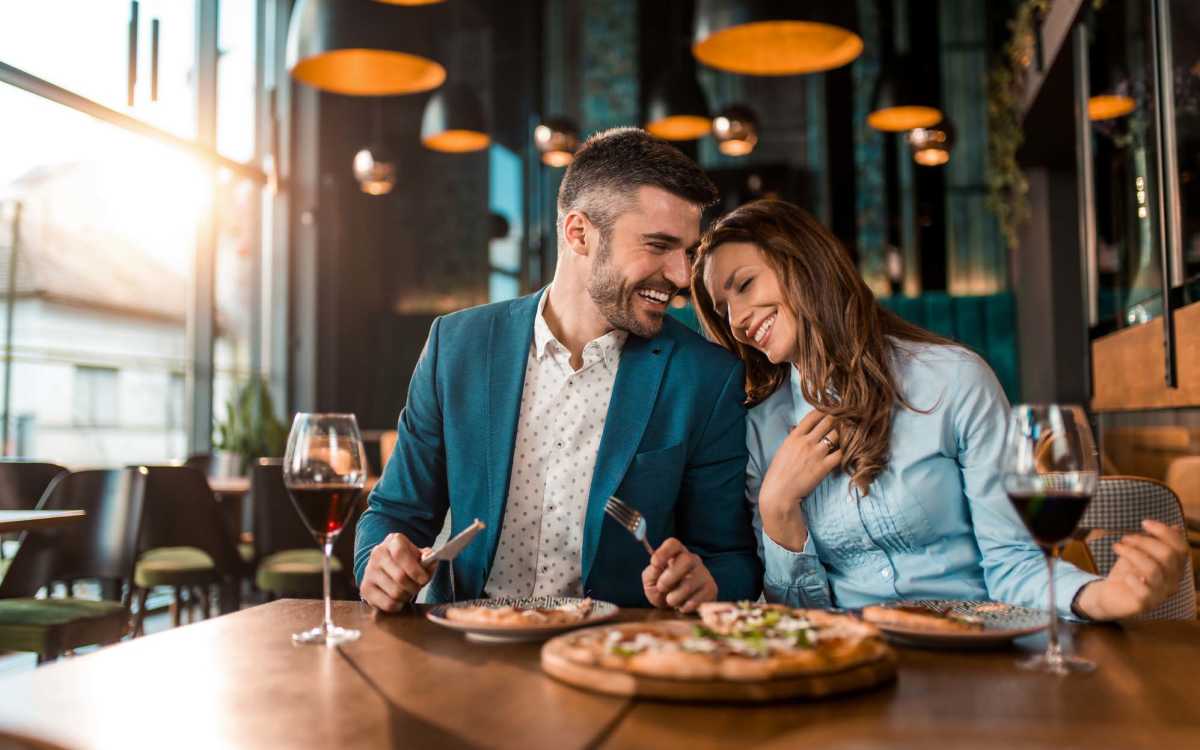 Couple having food at their favourite restaurant at Huffman Mill Townhomes in Burlington, North Carolina