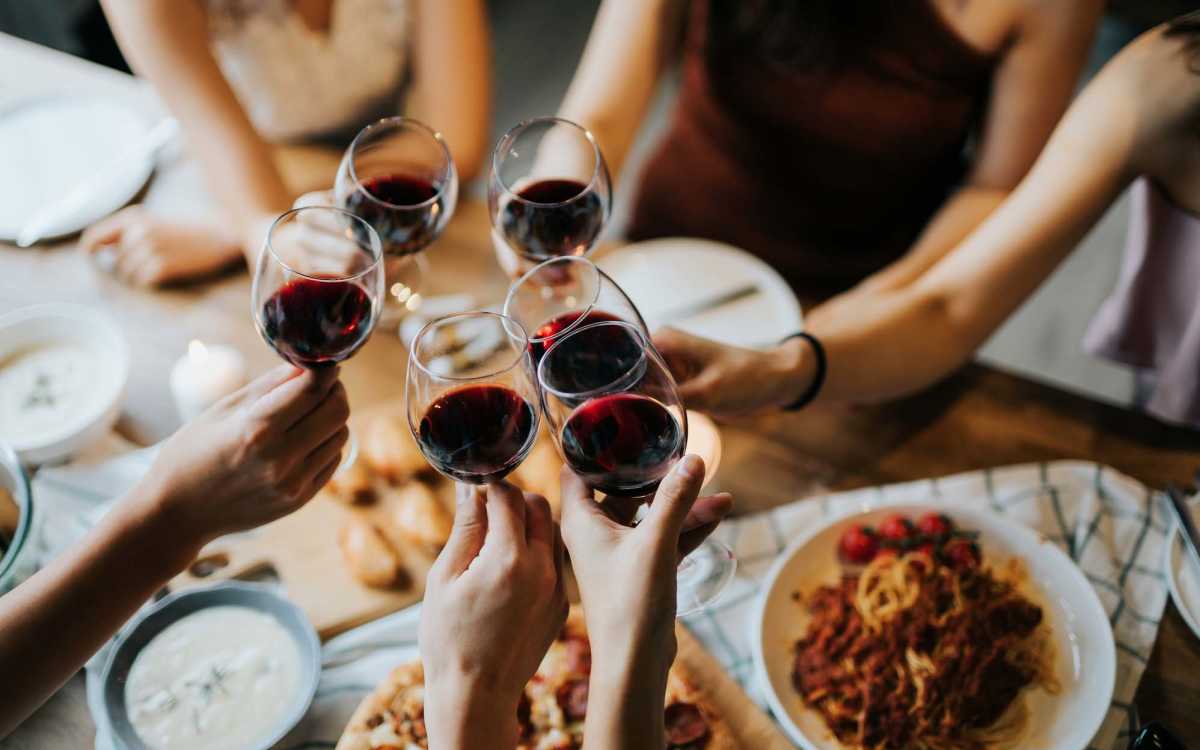 A group of friends toasting their glasses near Millcroft Apartments & Townhomes in Milford, Ohio