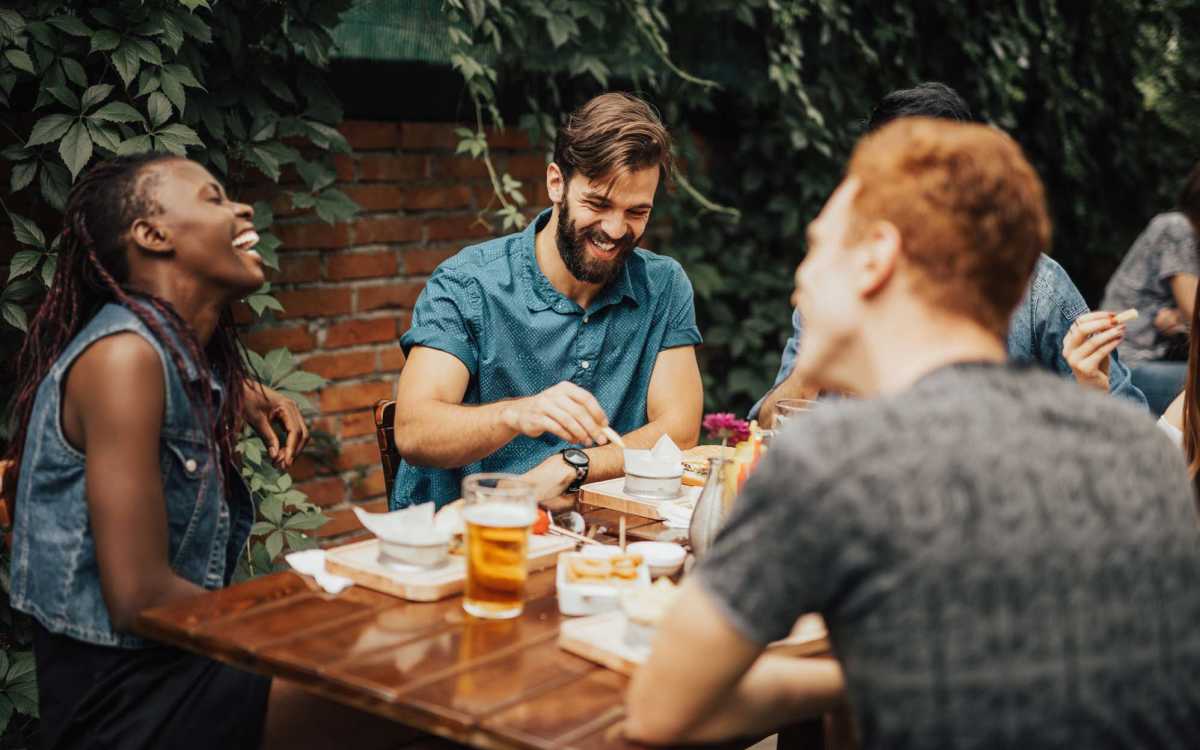 Resident eating with friends in restaurant near Anchorage in Mount Pleasant, South Carolina