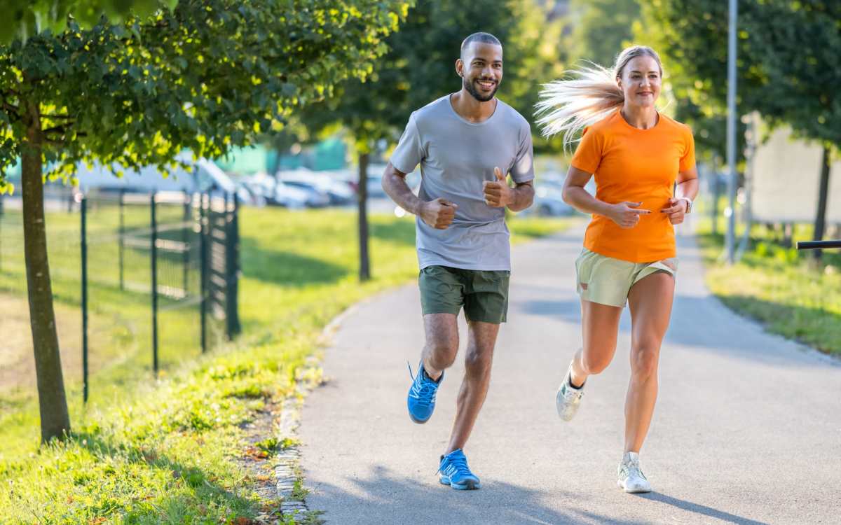 Resident couple jogging at a park near Woodland Grove in Naranja, Florida
